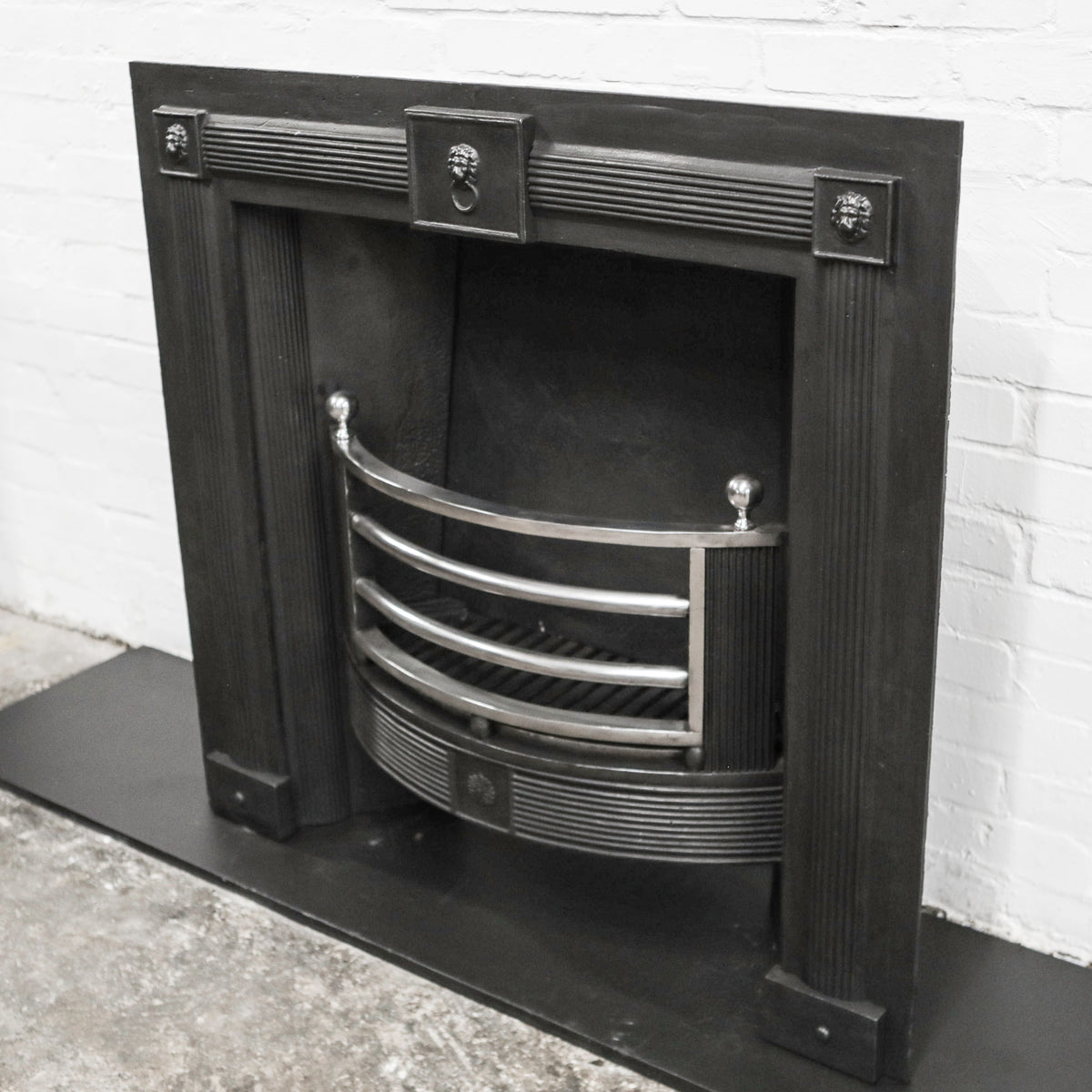 Antique Cast Iron Fireplace Insert with Polished Bars | The Architectural Forum