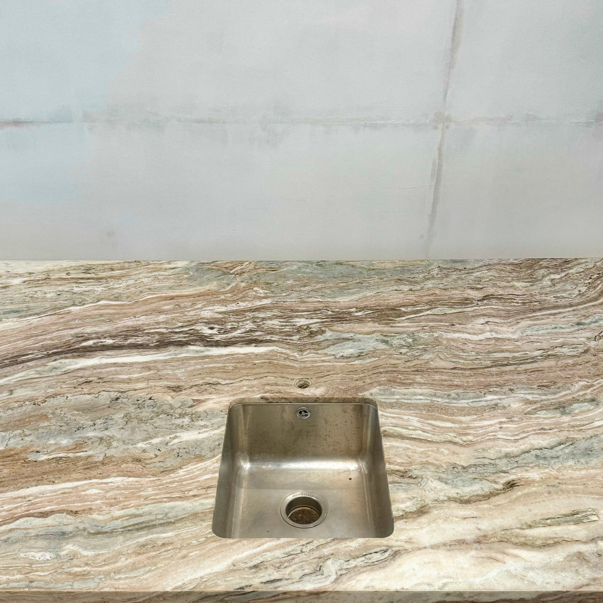 Brown and Green Marble Kitchen Island with Sink | The Architectural Forum