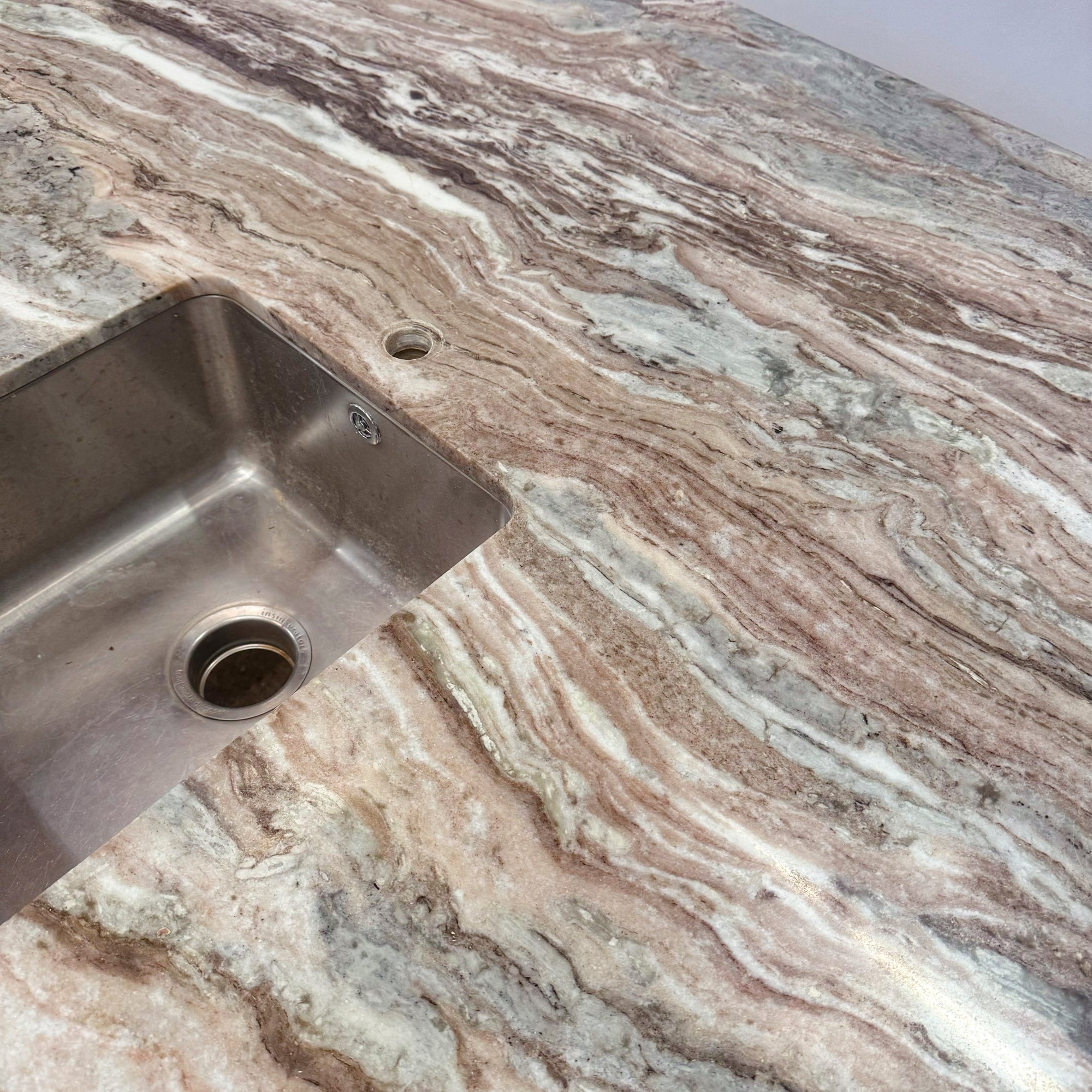 Brown and Green Marble Kitchen Island with Sink | The Architectural Forum