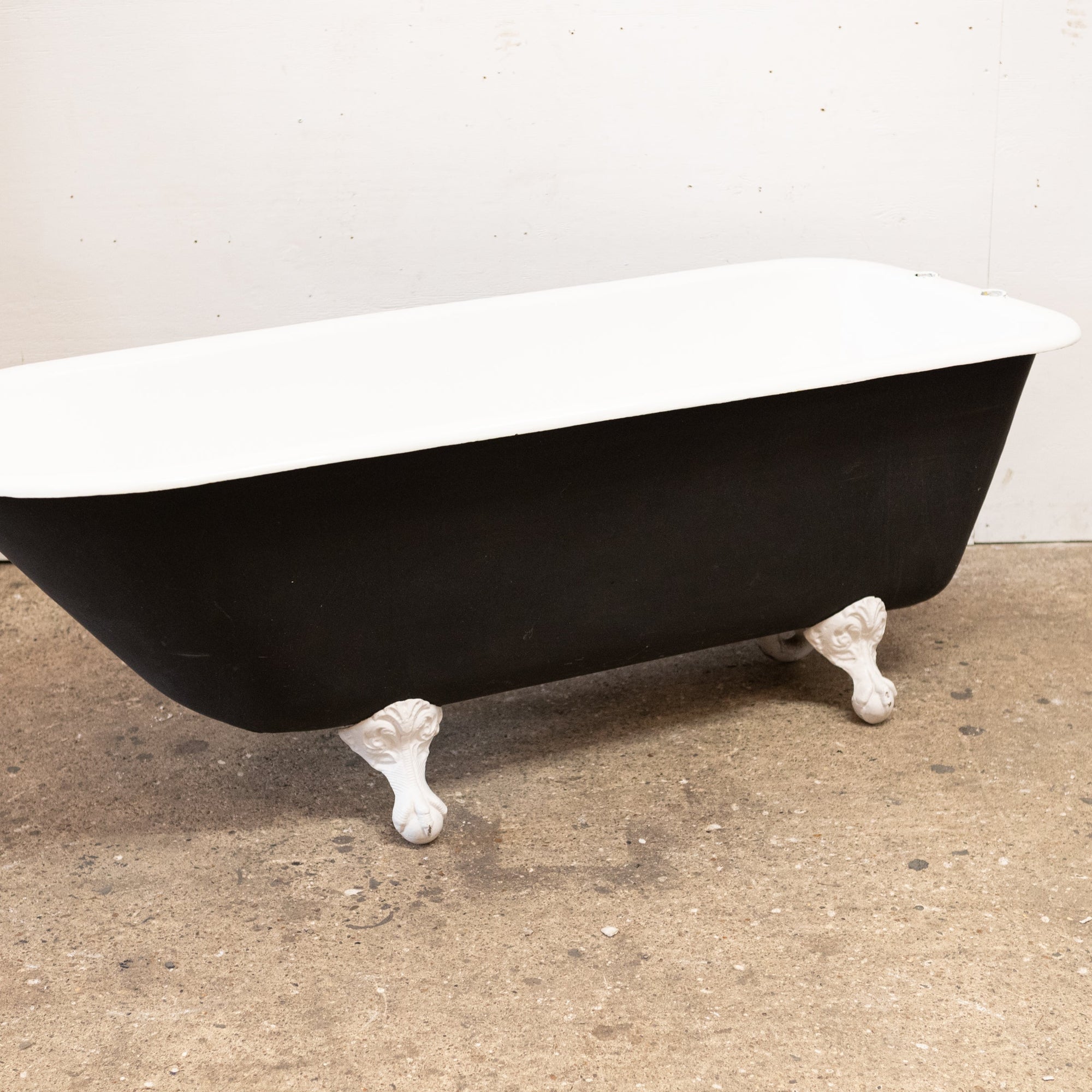 Reclaimed Cast Iron Roll Top Bath Tub with Claw Feet | The Architectural Forum